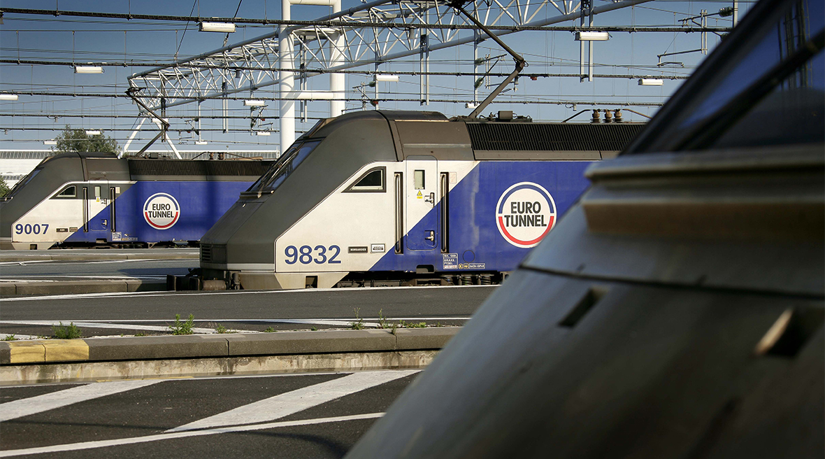 The nose of three trains with the Eurotunnel logo at the platform